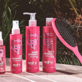 IN THIS PICTURE THEIR IS FOUR PINK HAIR PRODUCTS FROM SHE POFESSIONALS, ONE HAIR OIL, ONE RESTRUCTURING SPRAY, ONE SUPER MOISTURIZING MASK, ONE SUPER MOISTURIZING SHAMPOO AND A PINK BRUSH.